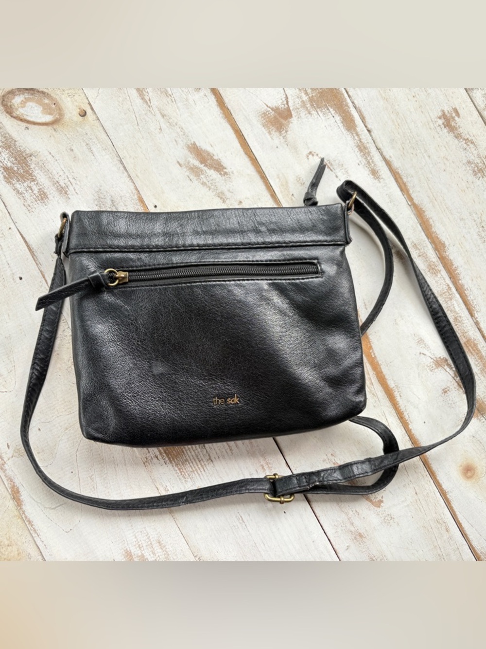 The Sak Sanibel mini crossbody purse black leather embossed floral boho casual
